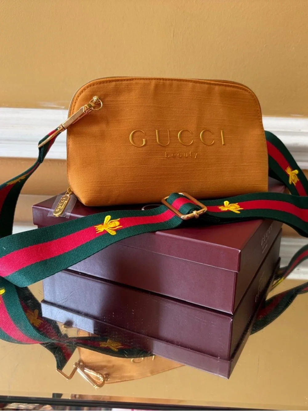 Gucci tan cosmetic pouch with teal and pink embroidered strap (no box)